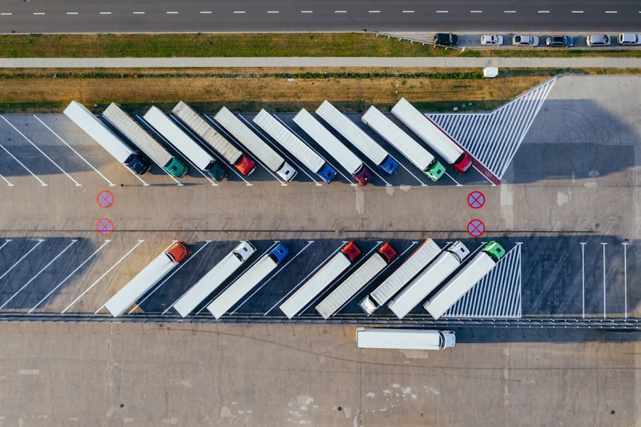 Aerial view of articulated trucks parked in a logistics yard