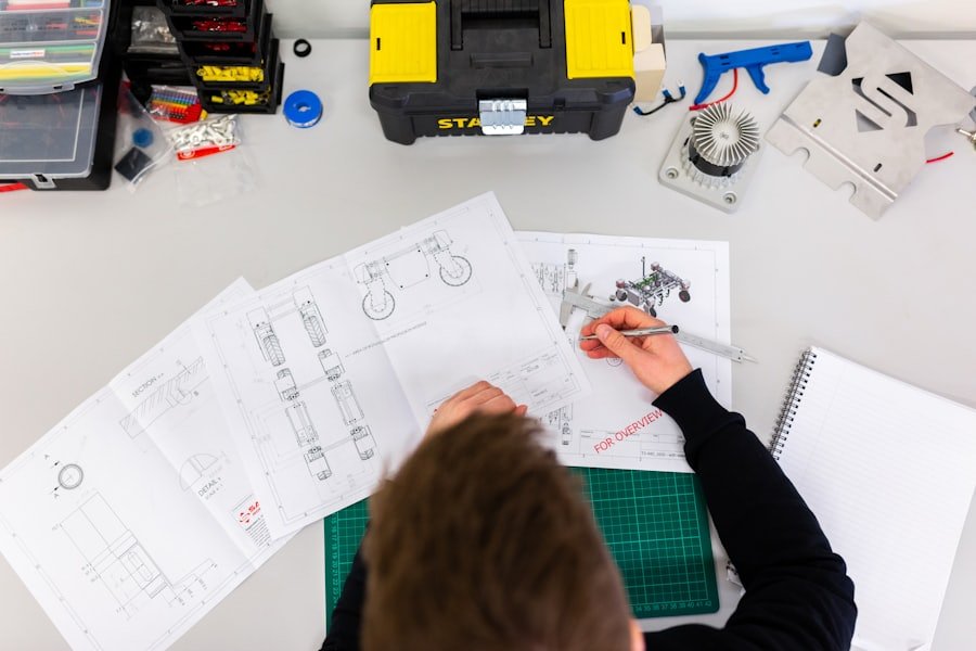 Engineer marking up technical drawings during an inspection review